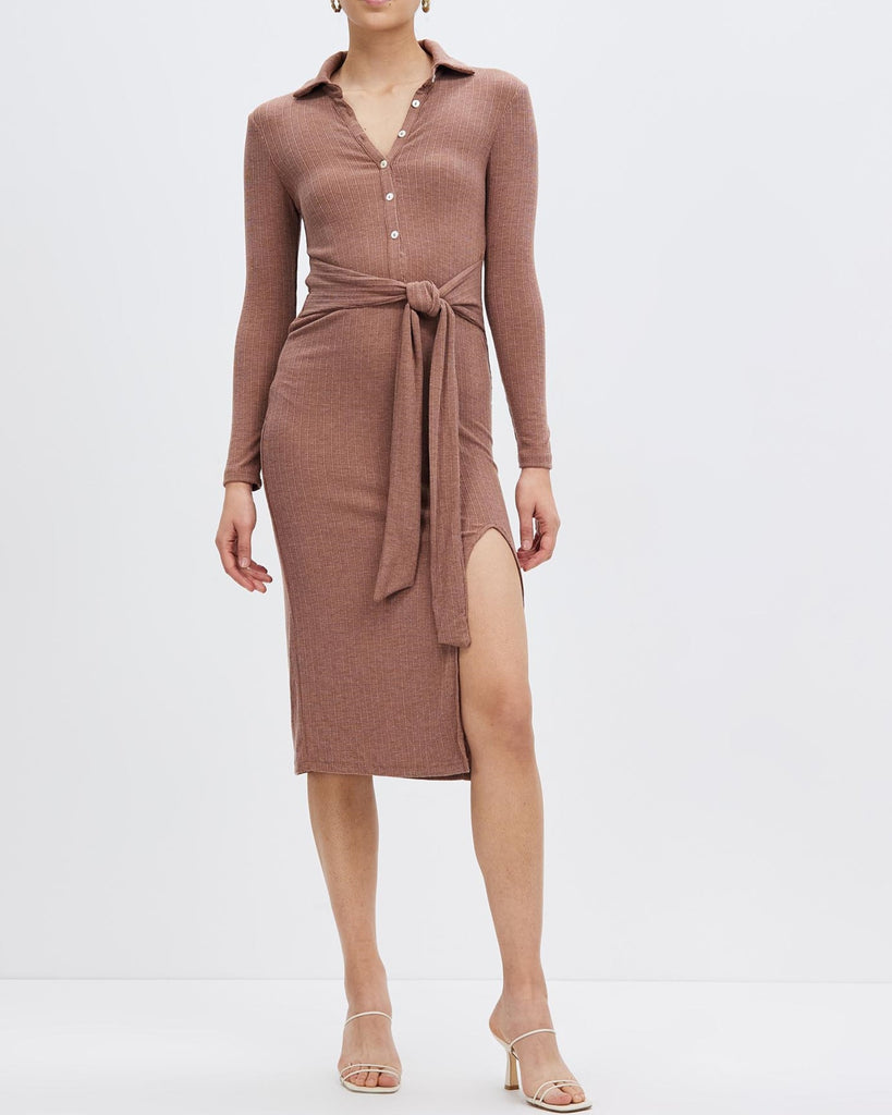 A brown dress with a high slit design, revealing the beauty of legs.