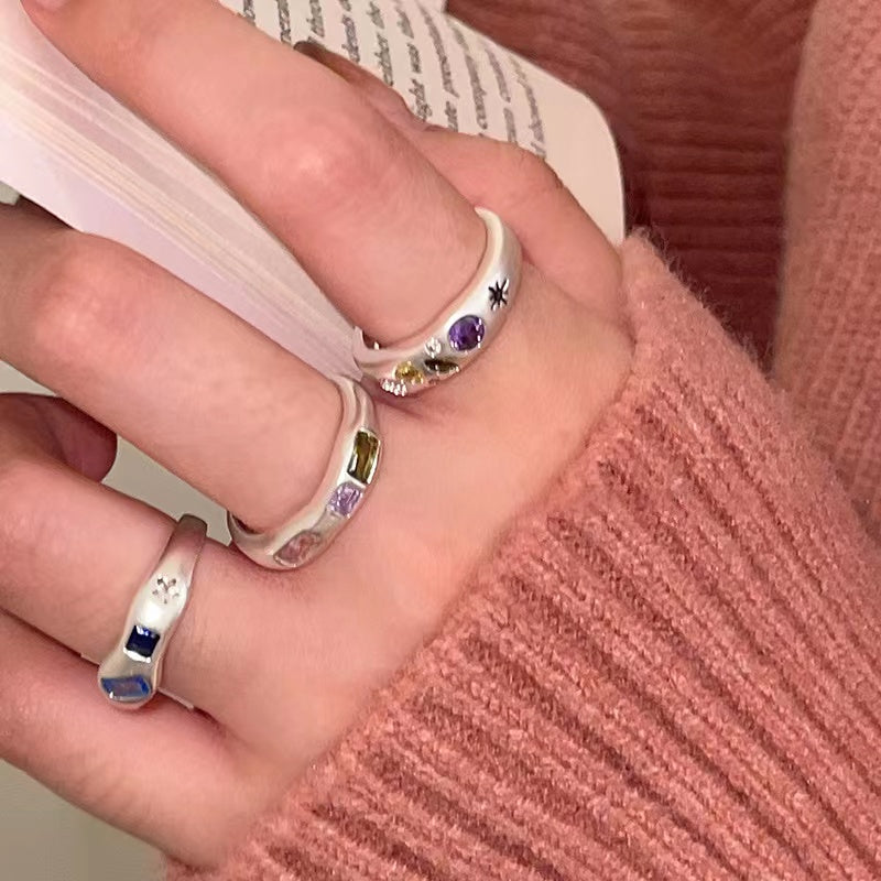 Colored diamond-encrusted open ring